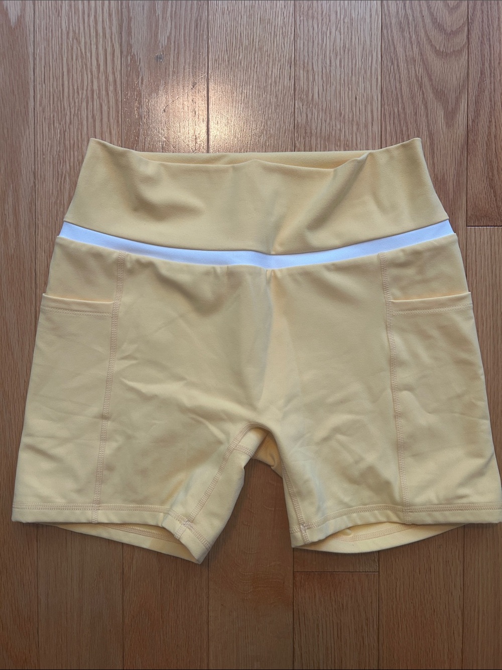 ZYIA Yellow High-Waist Bike Shorts with White Waistband and Side Pockets